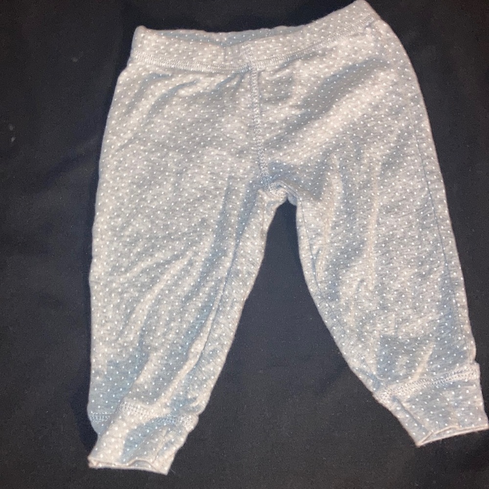 Gray pants with white polkadots with pink flamingo in the back